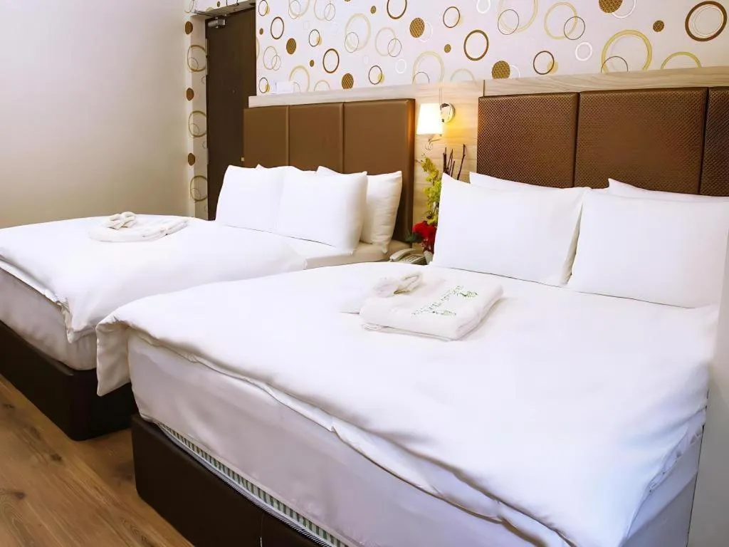 Bed in Tropicana Boutique Hotel