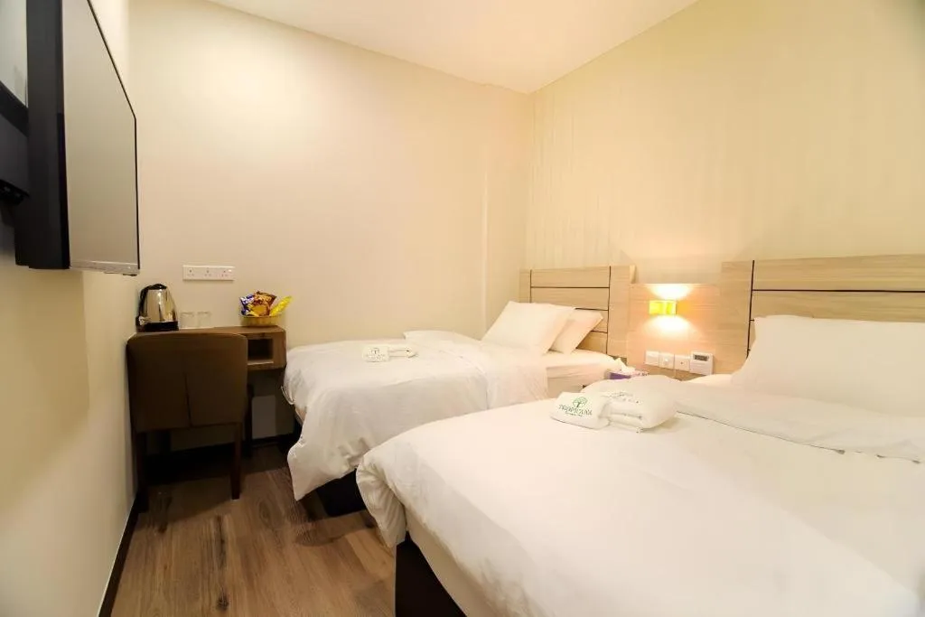 Bed in Tropicana Boutique Hotel