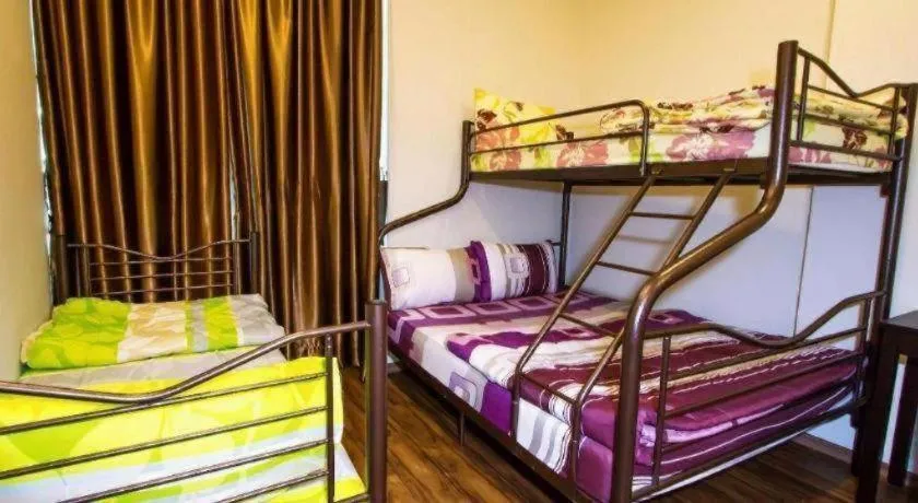 Bed in Tropicana Boutique Hotel