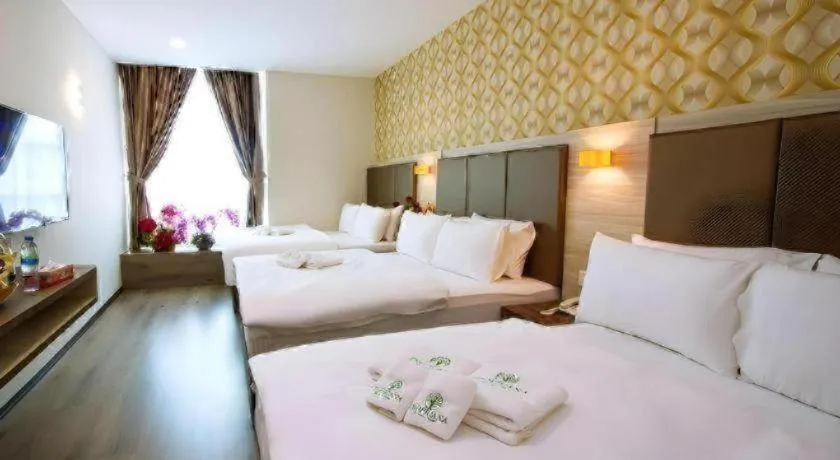 Bed in Tropicana Boutique Hotel