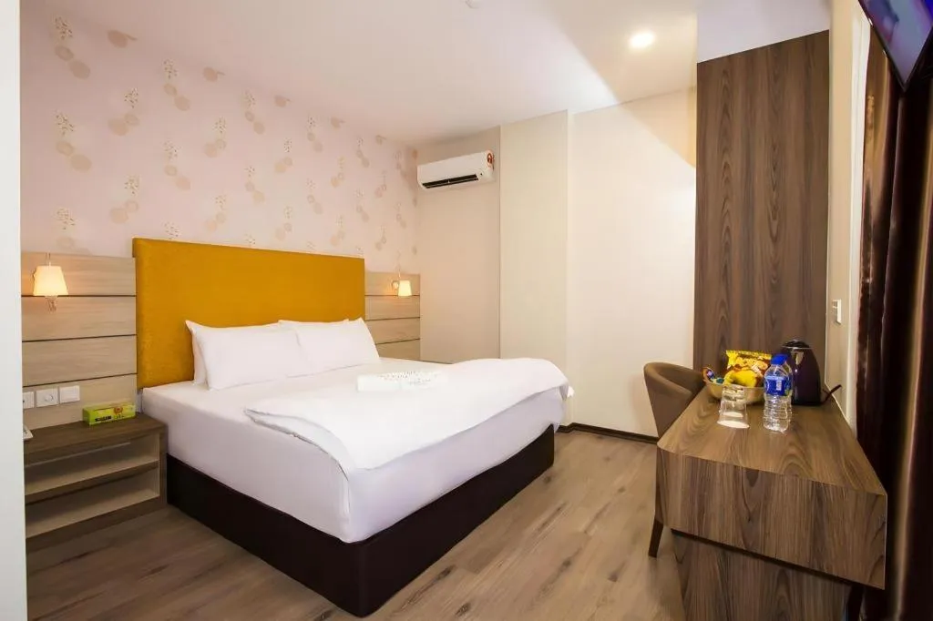 Bed in Tropicana Boutique Hotel