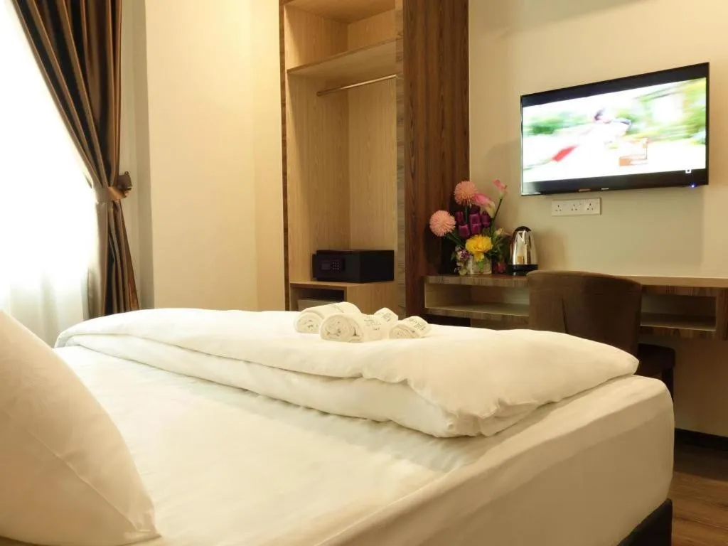 Bed in Tropicana Boutique Hotel