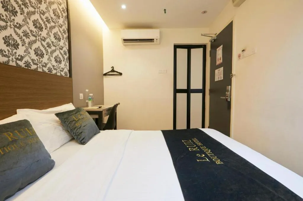 Bed in Le Ruiz Boutique Hotel