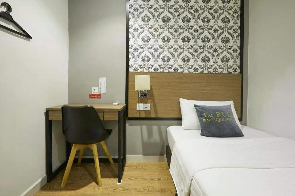 Bed in Le Ruiz Boutique Hotel