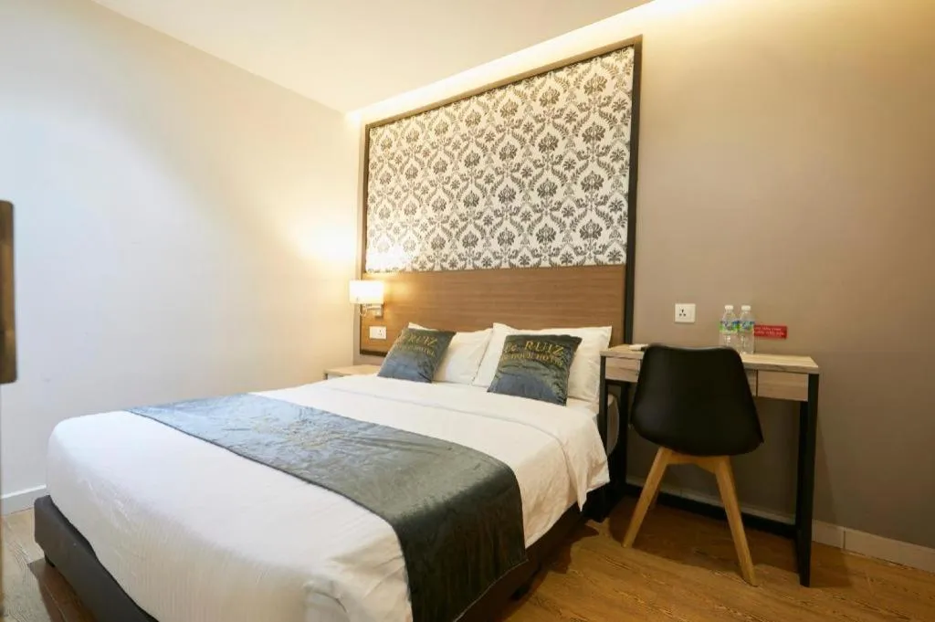 Bed in Le Ruiz Boutique Hotel