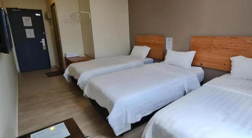 Bed in Sg. Paka Hotel