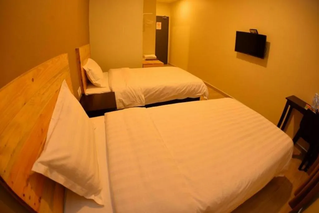 Bed in Sg. Paka Hotel