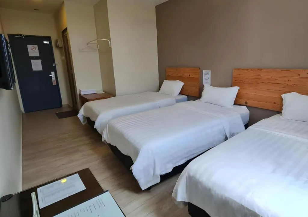 Bed in Sg. Paka Hotel