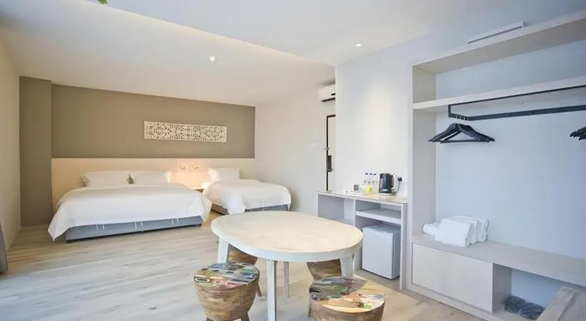 Bed in M Plus Boutique Hotel