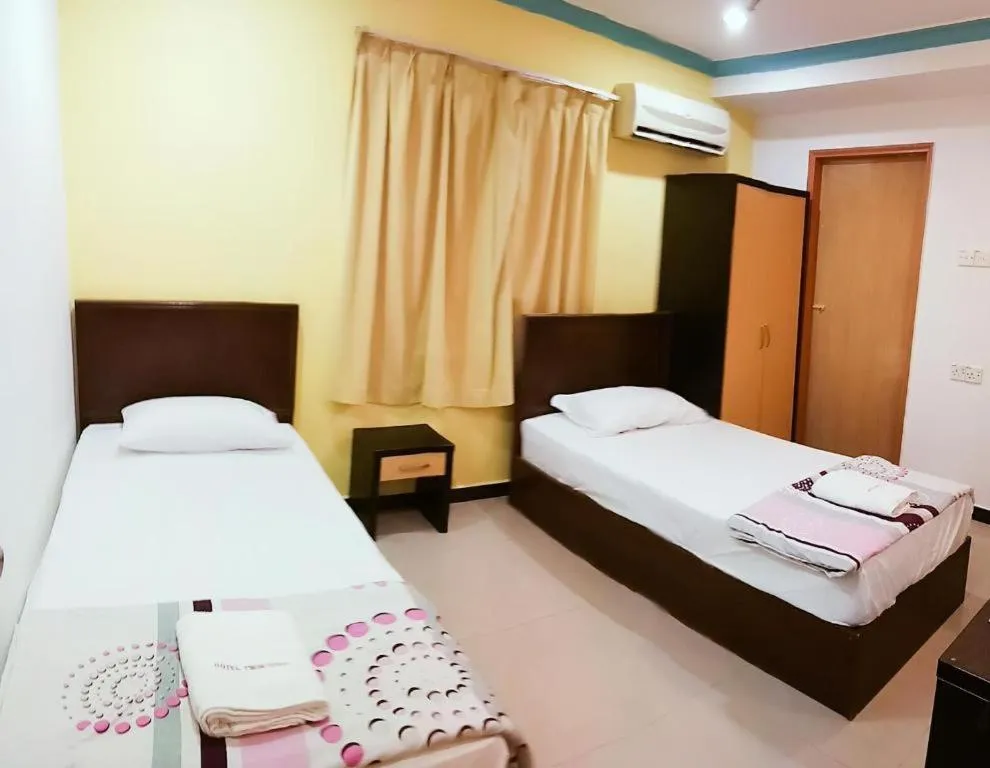 Bed in Twin Star Hotel