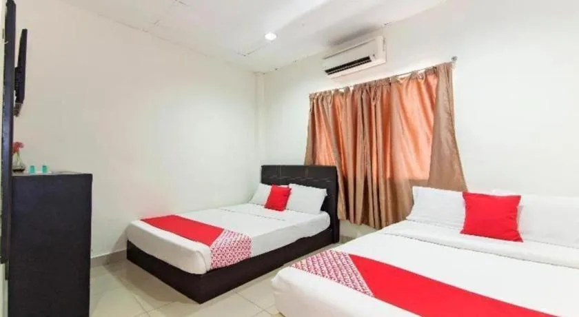 Bed in OYO 304 Zero Hour Hotel