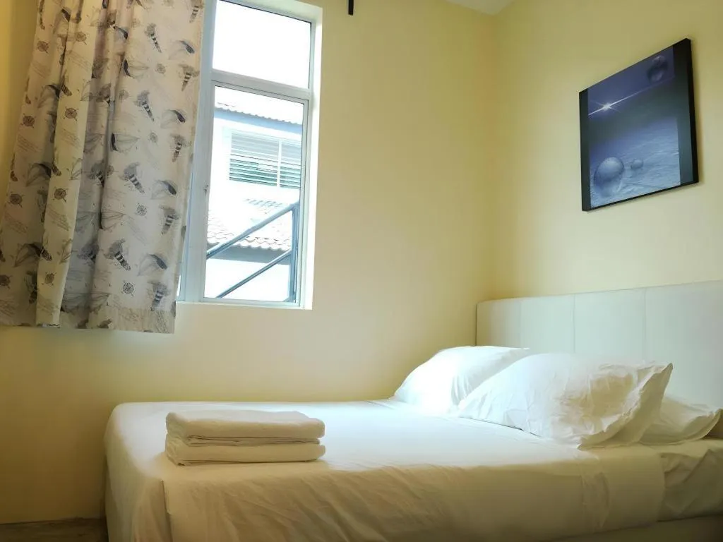 Bed in Hotel Pangkor Mutiara