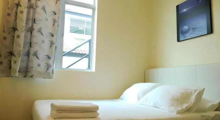 Bed in Hotel Pangkor Mutiara