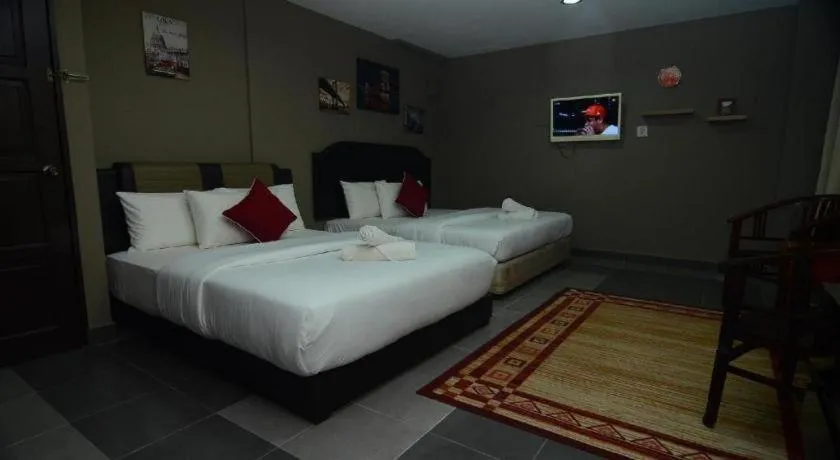 Bed in AMT BUDGET HOTEL