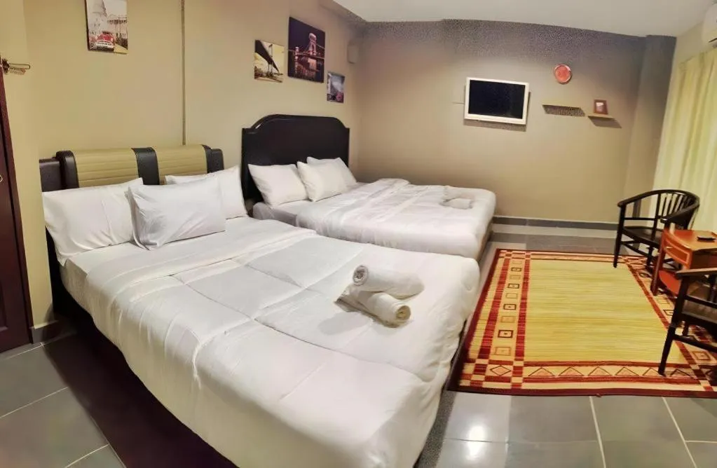 Bed in AMT BUDGET HOTEL