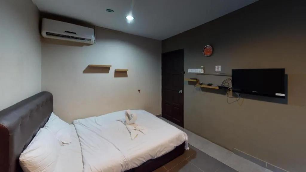 Bed in AMT BUDGET HOTEL