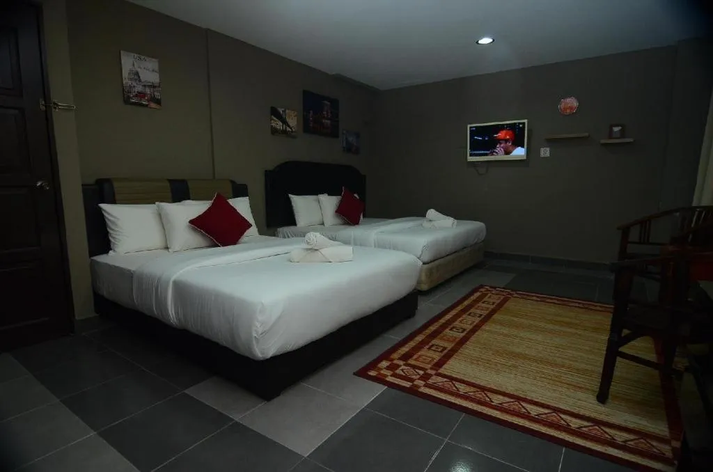 Bed in AMT BUDGET HOTEL