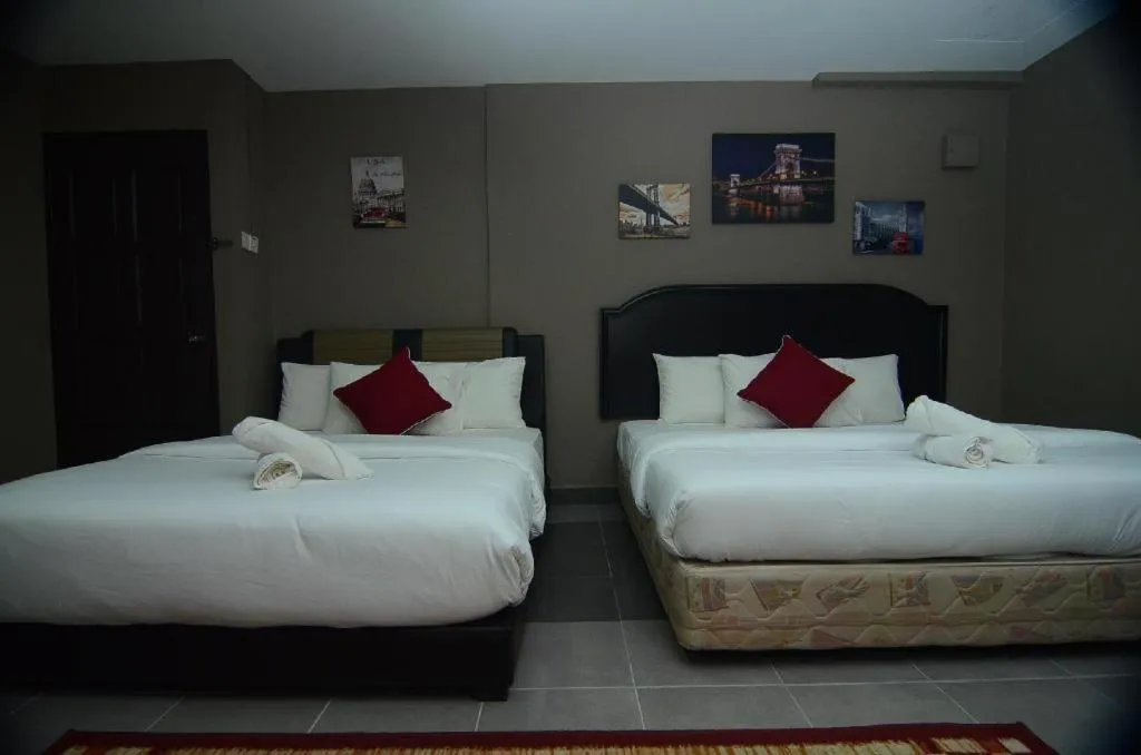 Bed in AMT BUDGET HOTEL