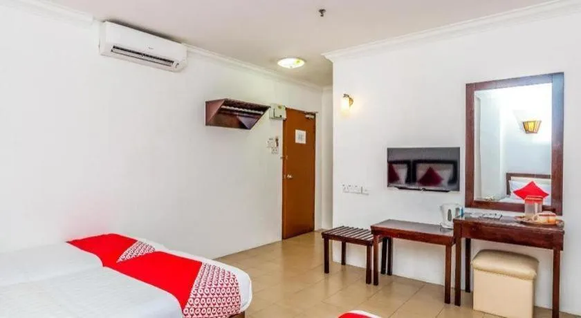 Bed in OYO 1114 Neo Pegasus Hotel