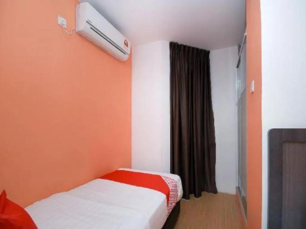 Bed in OYO 1111 Harmony Stay