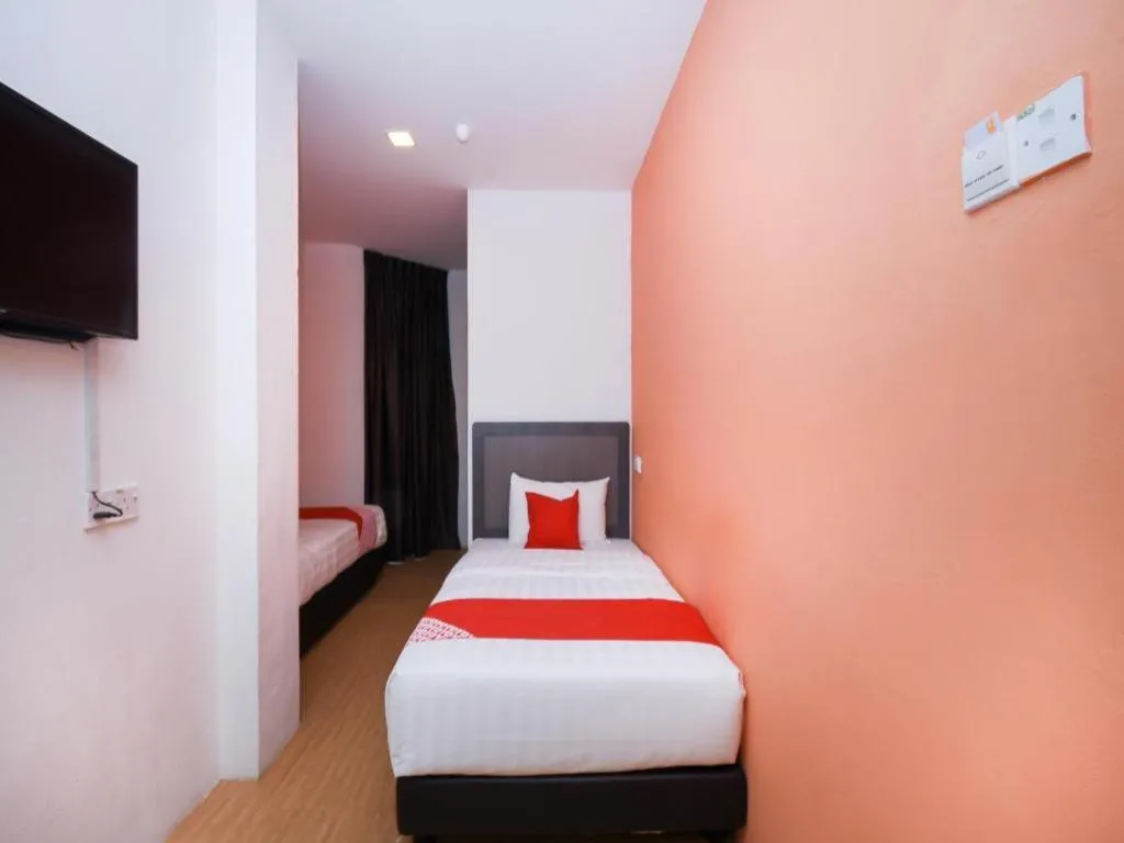 Bed in OYO 1111 Harmony Stay