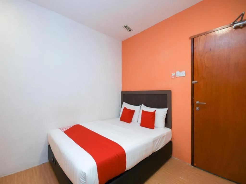 Bed in OYO 1111 Harmony Stay