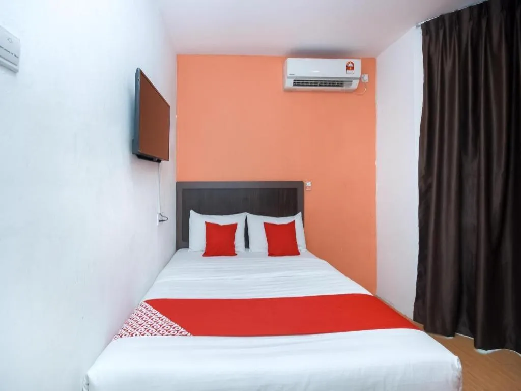 Bed in OYO 1111 Harmony Stay