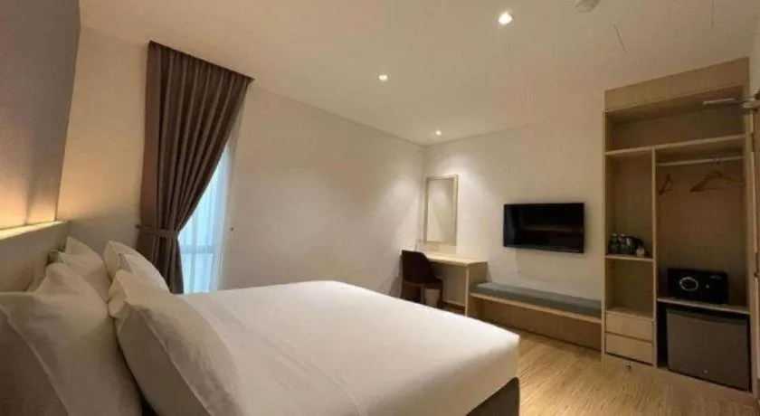 Bed in MIYABI HOTEL PERMAS