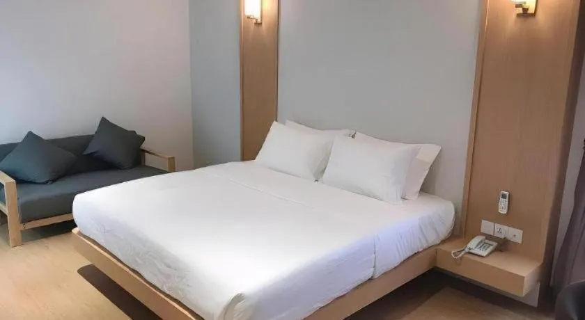 Bed in MIYABI HOTEL PERMAS