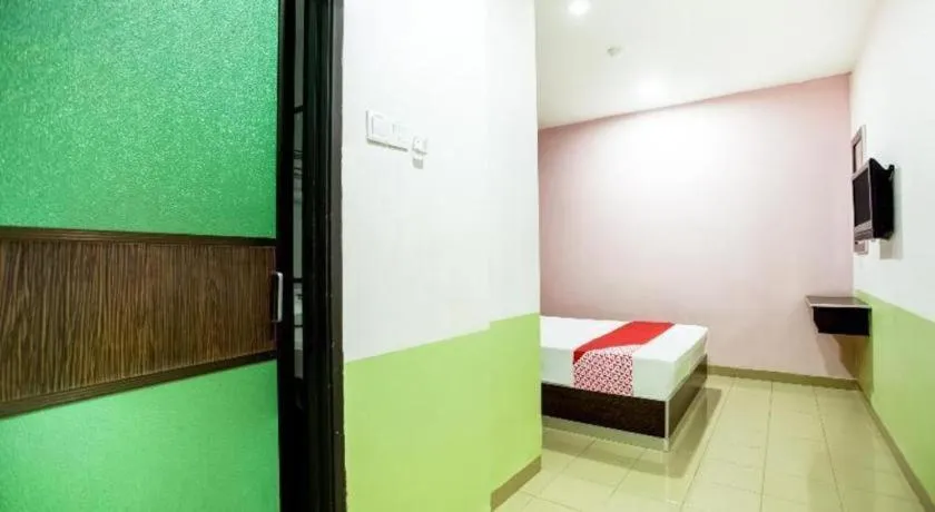 Bed in OYO 89539 Hotel Siswa