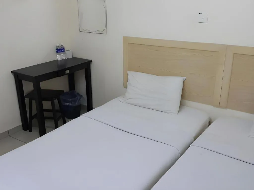 Bed in OYO 301 River Inn Hotel