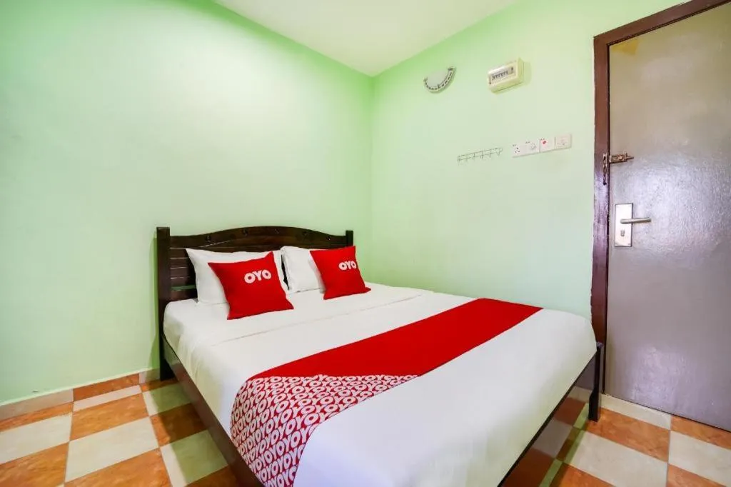 Bed in OYO 44058 MOTEL SRE BAYAM