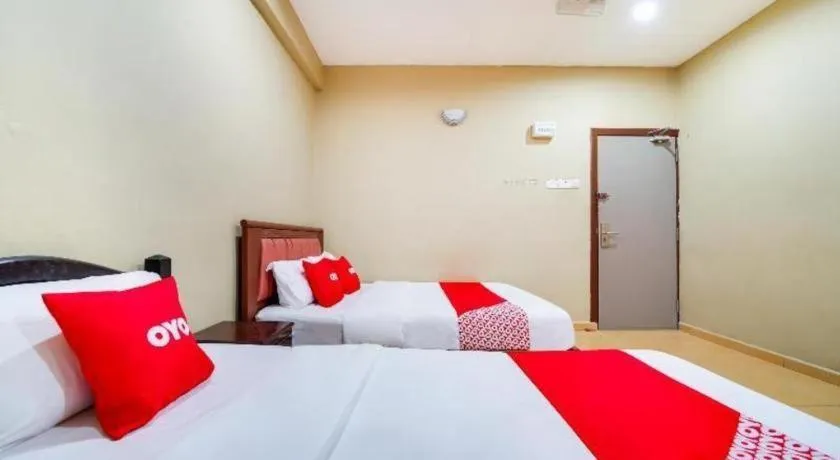 Bed in OYO 44058 MOTEL SRE BAYAM