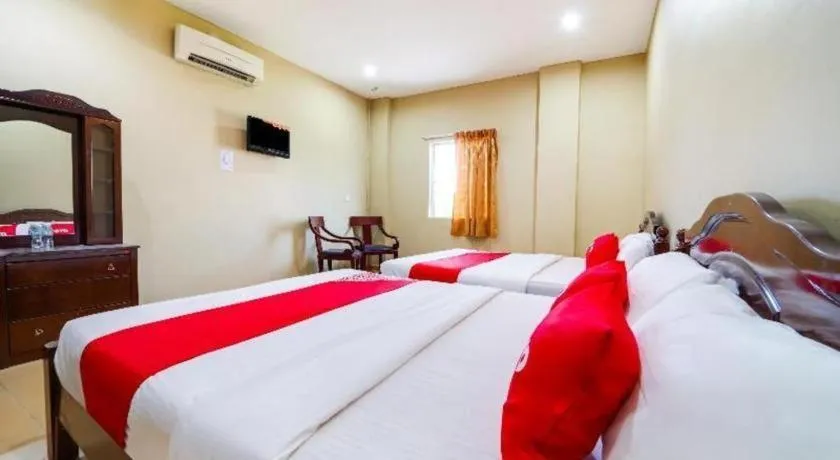 Bed in OYO 44058 MOTEL SRE BAYAM