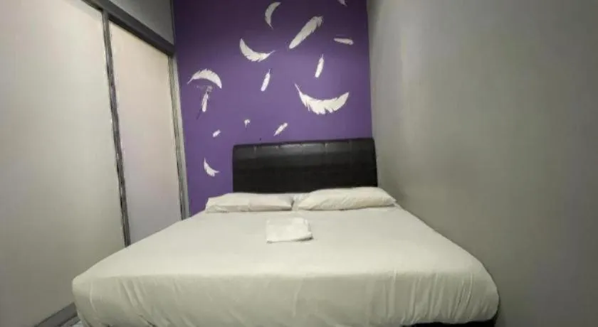 Bed in OYO 89760 Harmoni Inn Hotel