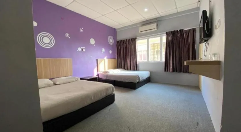 Bed in OYO 89760 Harmoni Inn Hotel