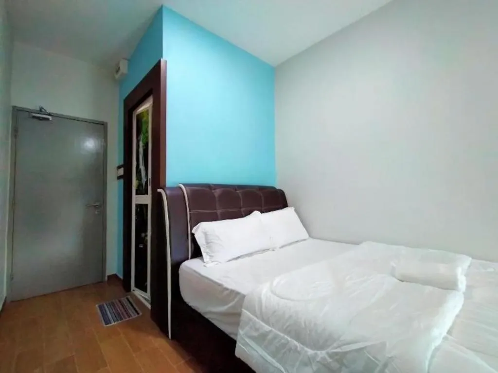 Bed in OYO 89859 PP Traveller's Hotel