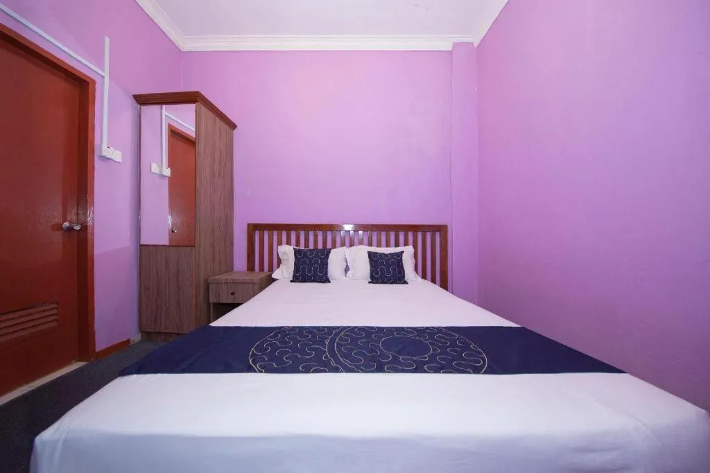 Bed in Capital O 89876 Safari Hotel