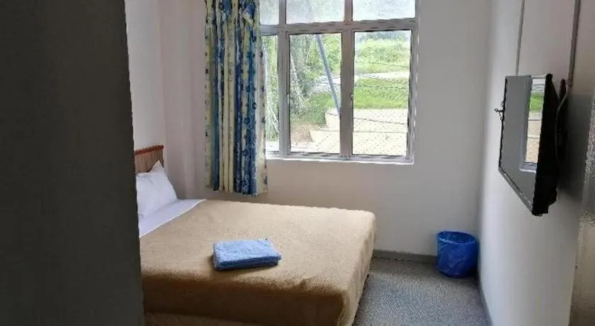 Bed in Capital O 89876 Safari Hotel