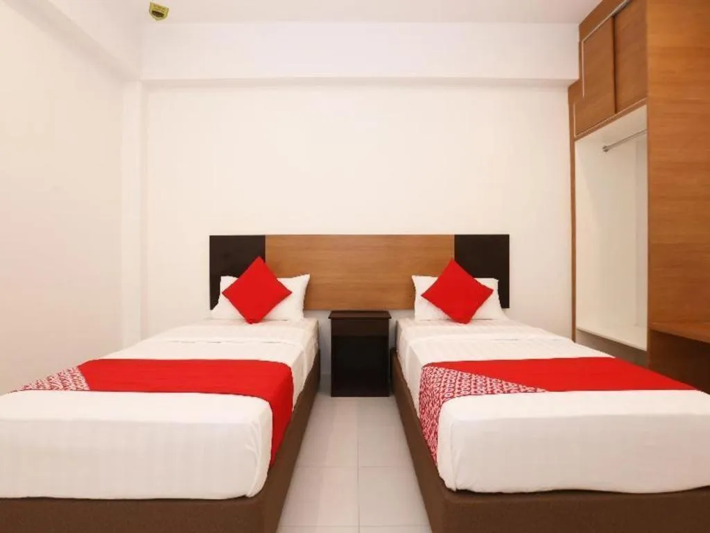 Bed in OYO 89888 DZ Residence Guest House