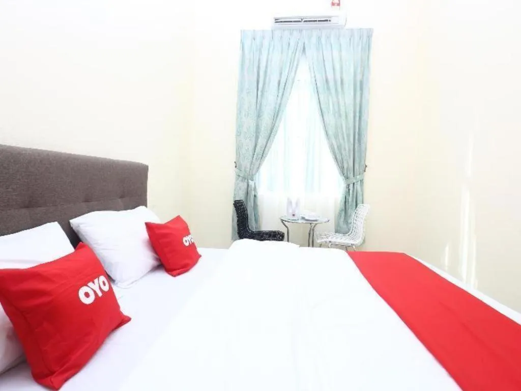 Bed in OYO 89607 Aloha Chalet