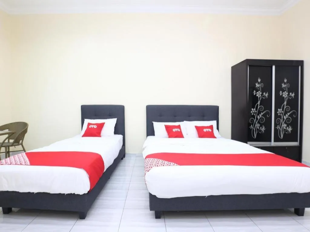 Bed in OYO 89607 Aloha Chalet