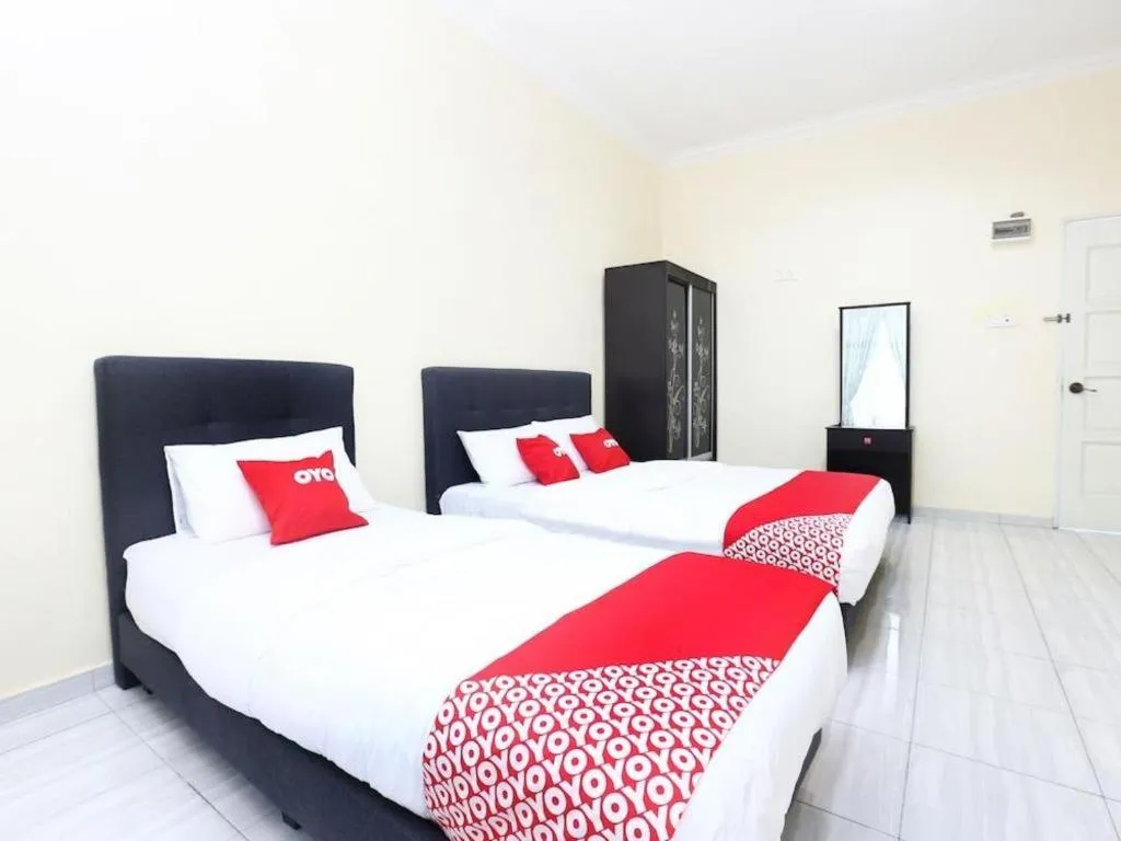 Bed in OYO 89607 Aloha Chalet