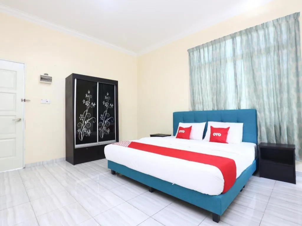 Bed in OYO 89607 Aloha Chalet