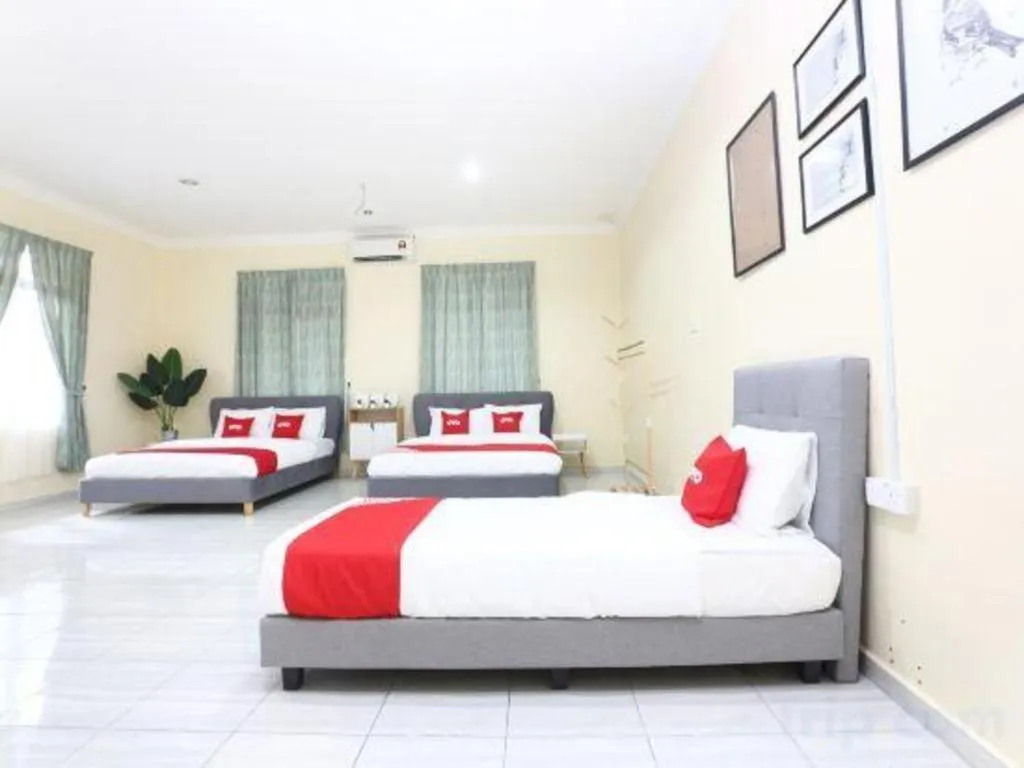 Bed in OYO 89607 Aloha Chalet