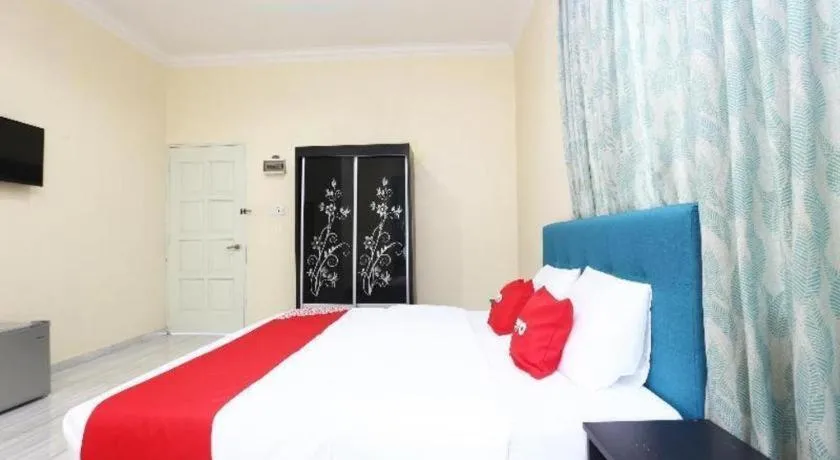 Bed in OYO 89607 Aloha Chalet