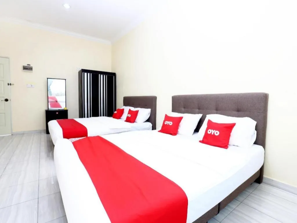 Bed in OYO 89607 Aloha Chalet