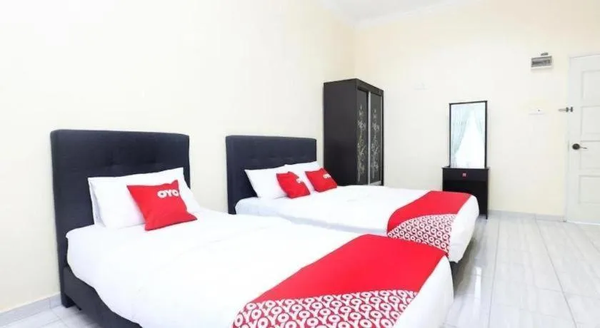 Bed in OYO 89607 Aloha Chalet