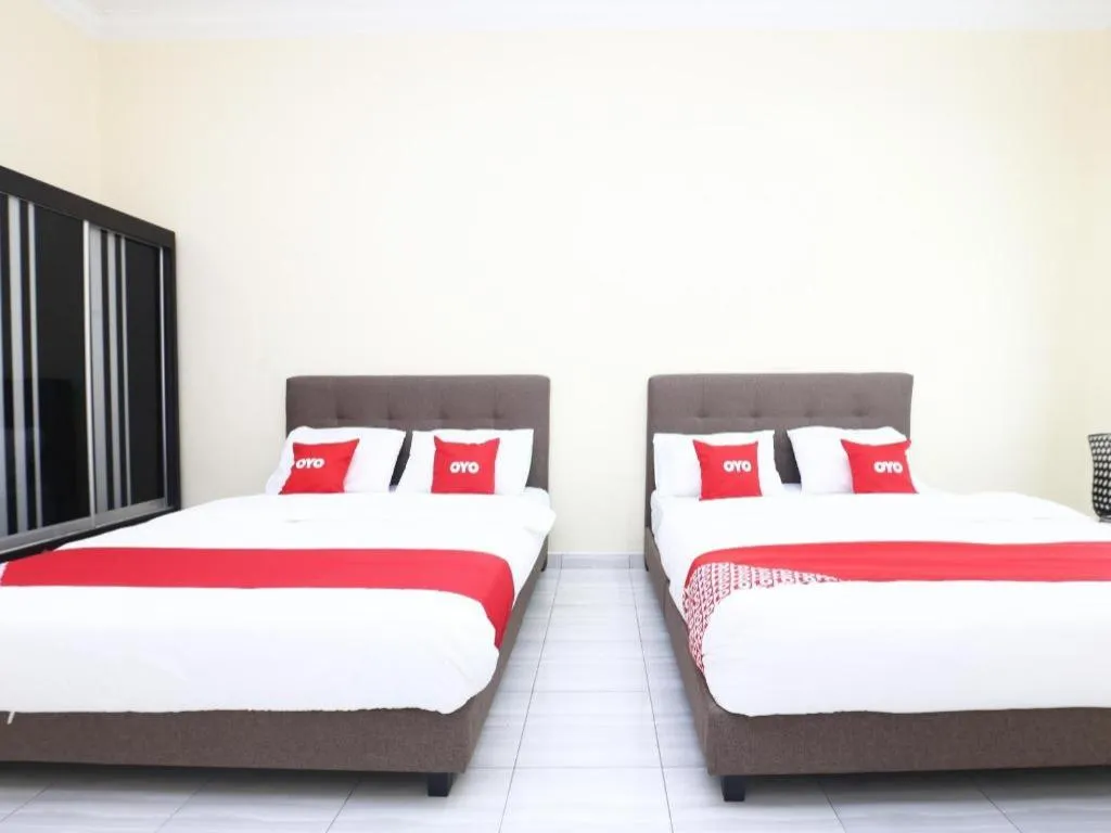 Bed in OYO 89607 Aloha Chalet