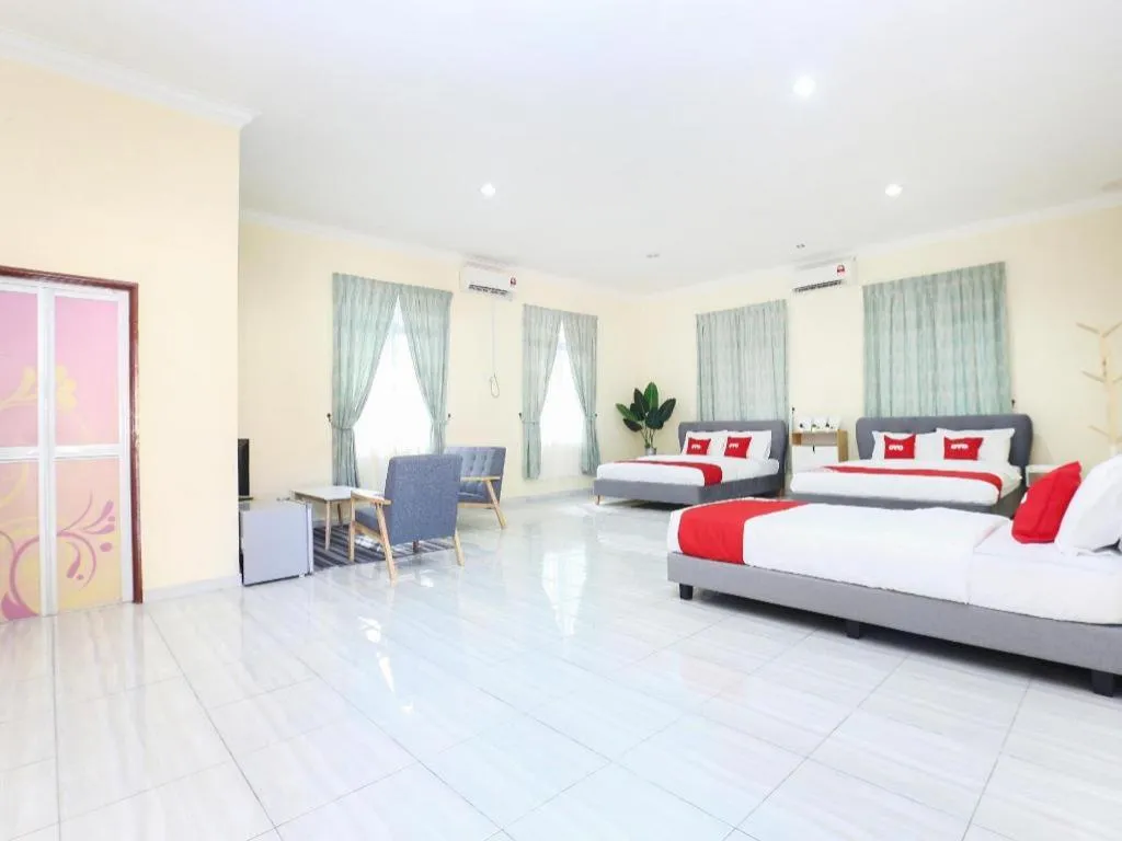 Bed in OYO 89607 Aloha Chalet